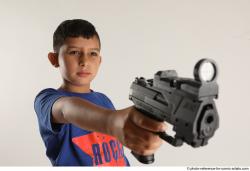 TIMBO STANDING POSE WITH GUN